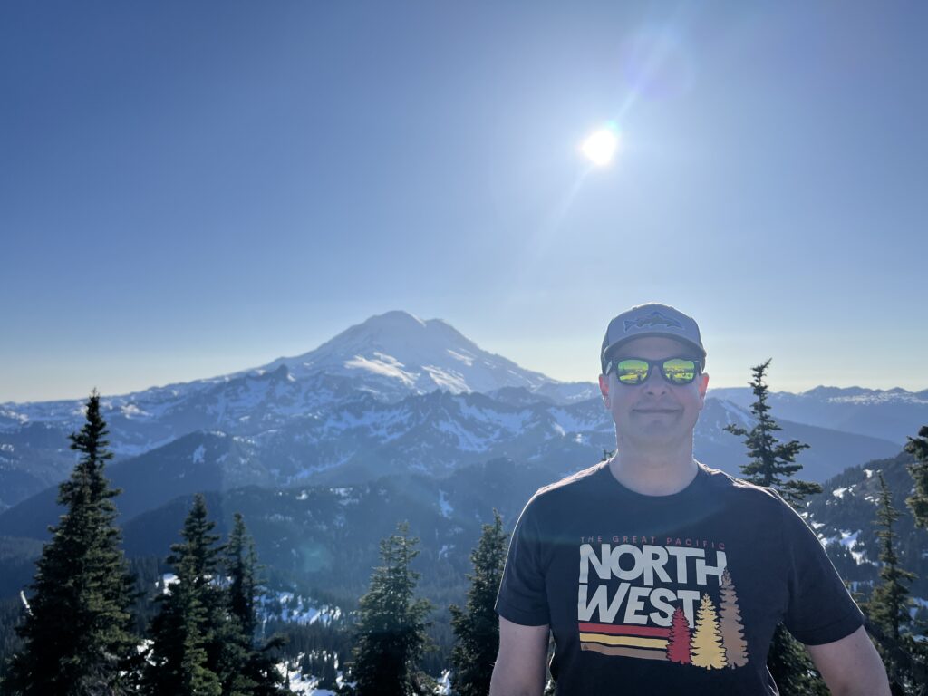 The Great PNW tee from Naches Peak, Tahoma (Mt. Rainier) in the background. 4 June 2023 by Daryl Greaser