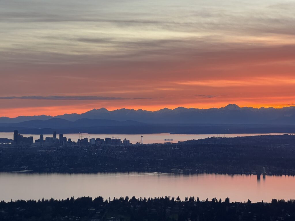 Lake Washington, Puget Sound, Olympic mountains, downtown Seattle and the Space Needle at sunset. Photo by Daryl Greaser 29 March 2023