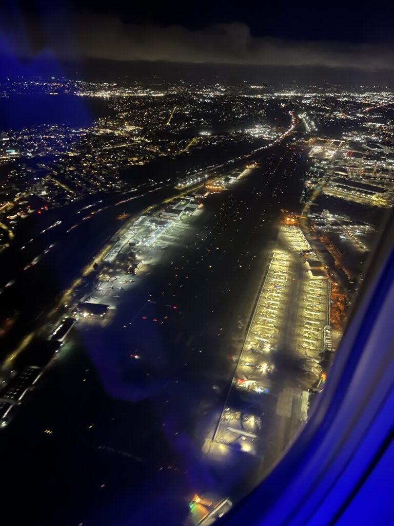 Boeing Field on final approach to Sea-Tac (SEA) in an Alaska 737. Note the new airplanes under the lights. King County International Airport - Boeing Field BFI KBFI at night 