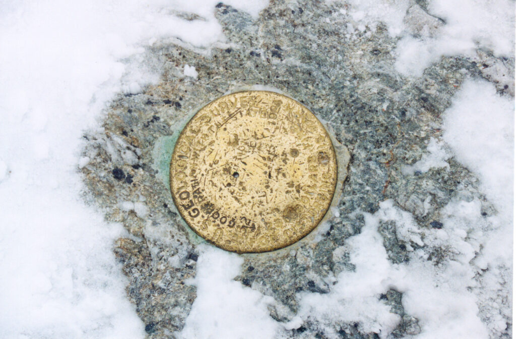 Summit benchmark on Mount Mansfield, Vermont. 
